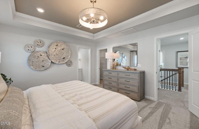 a bed room with a bed and a clock