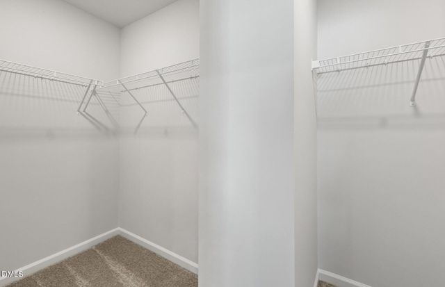 a bathroom with a double vanity sink toilet and shower