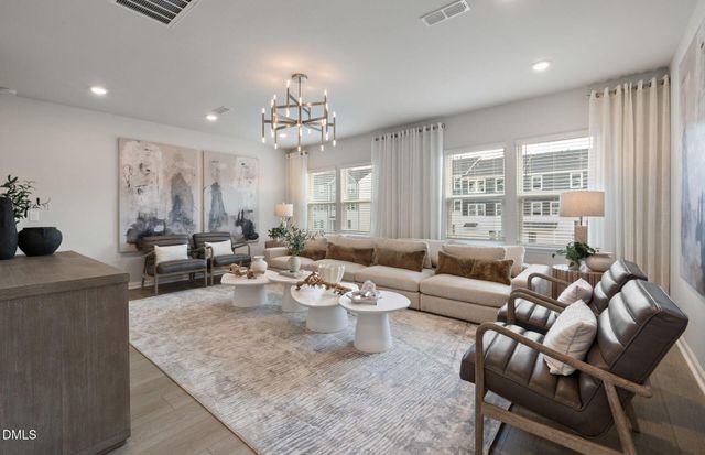 a view of a dining room with furniture and window
