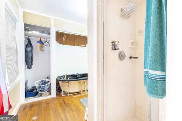 a bedroom with a bed and a mirror