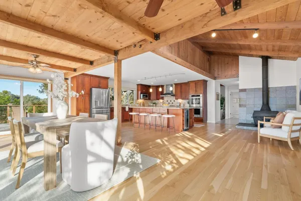 a view of a living room and kitchen