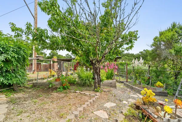 a backyard of a house with lots of green space