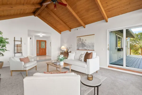 a living room with furniture and a painting