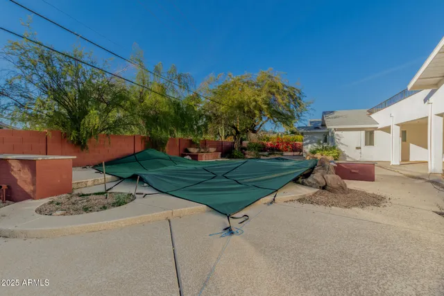 a view of a front door of the house and outdoor shower
