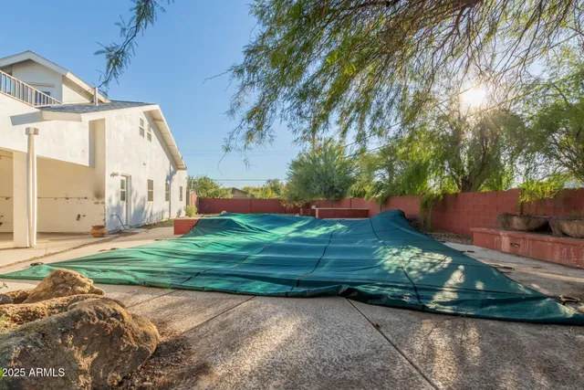 a view of an empty room with windows