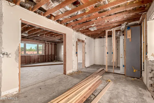 an aerial view of multiple houses with yard