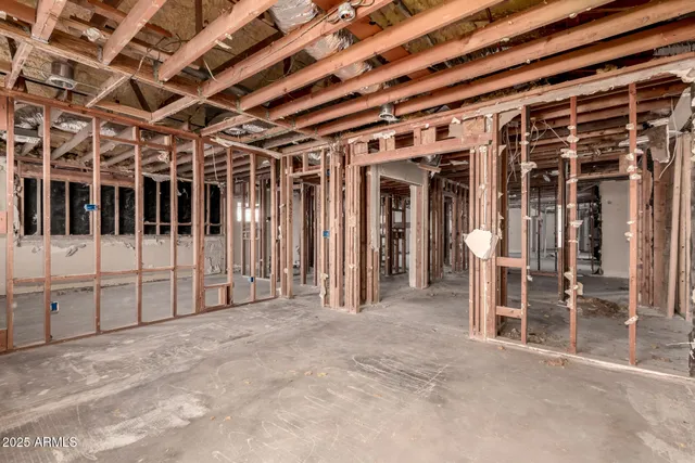 a room with potted plants and a table