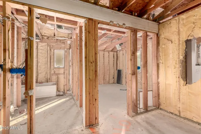 a view of a patio with table and chairs with wooden floor and fence