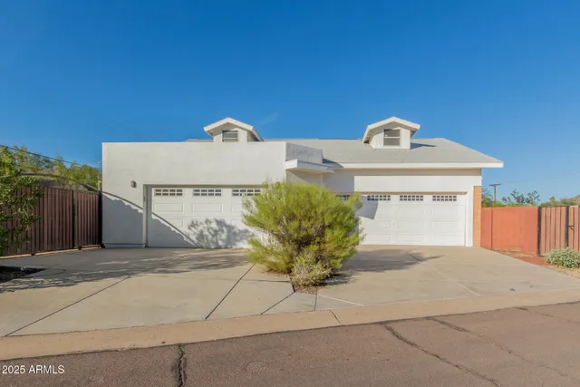 a front view of a house with a garage
