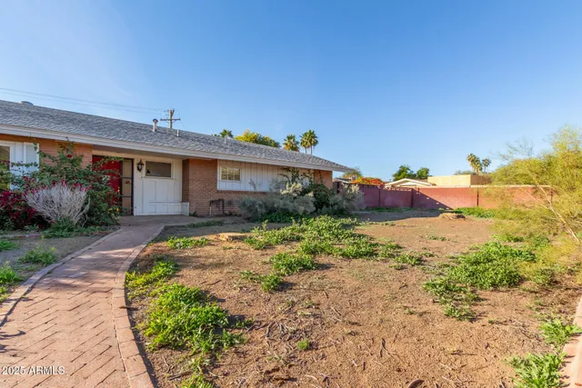 a view of a lake with houses in the back