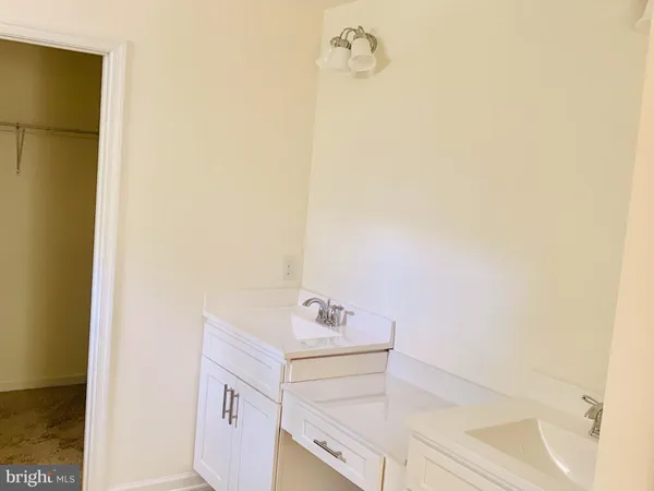 a living room with a fireplace and a fireplace