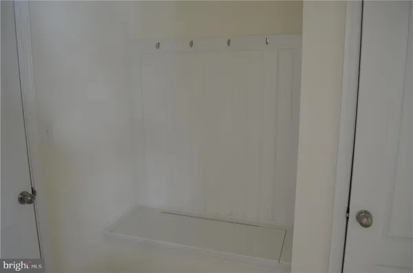 a view of an empty room with a fireplace