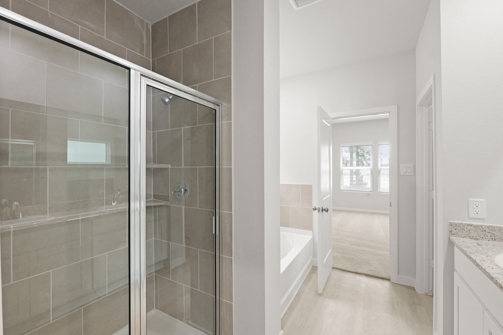 4414 Albritton Avenue Bryan, TX 77845 - Photo 26 of 34 a bathroom with a glass shower door