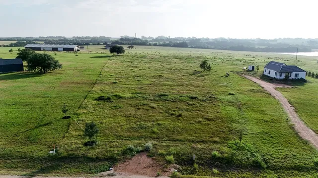 a view of a large body of water with a building in the background