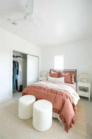 a bedroom with a bed and a couch