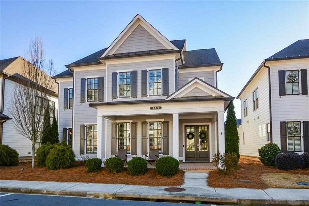 a front view of a house with garden