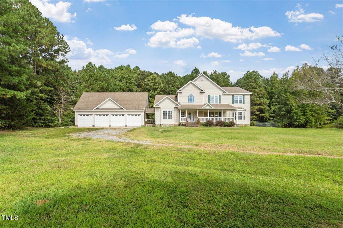 1175 Faulkner Town Road Henderson, NC 27537 - Photo 1 of 48 a front view of a house with garden