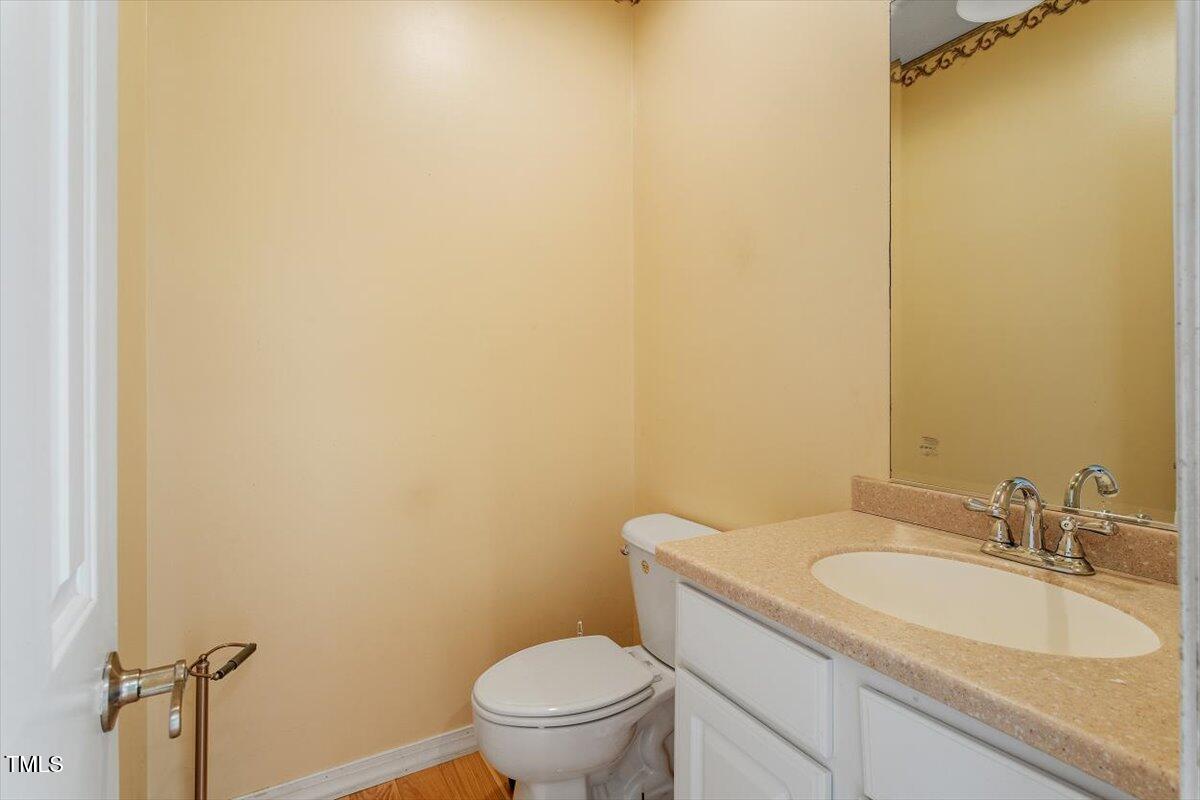 1175 Faulkner Town Road Henderson, NC 27537 - Photo 16 of 48 a bathroom with a sink and a toilet