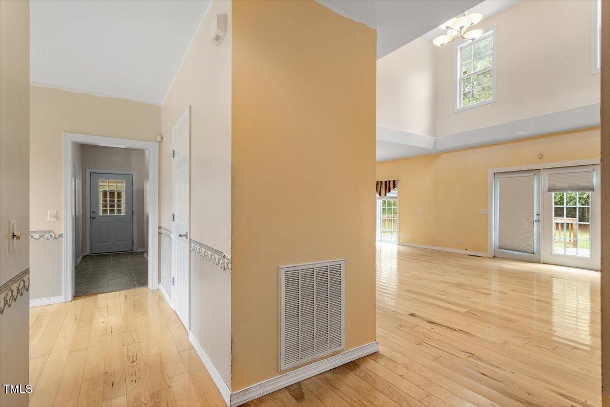 1175 Faulkner Town Road Henderson, NC 27537 - Photo 17 of 48 a view of a hallway with wooden floor and closet area