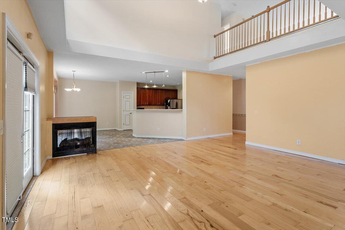 1175 Faulkner Town Road Henderson, NC 27537 - Photo 20 of 48 a view of empty room with wooden floor and furniture