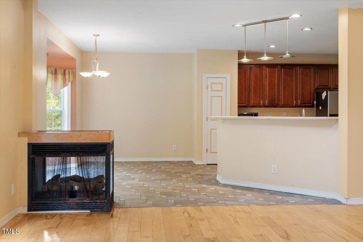 1175 Faulkner Town Road Henderson, NC 27537 - Photo 21 of 48 a view of a livingroom with a fireplace and window