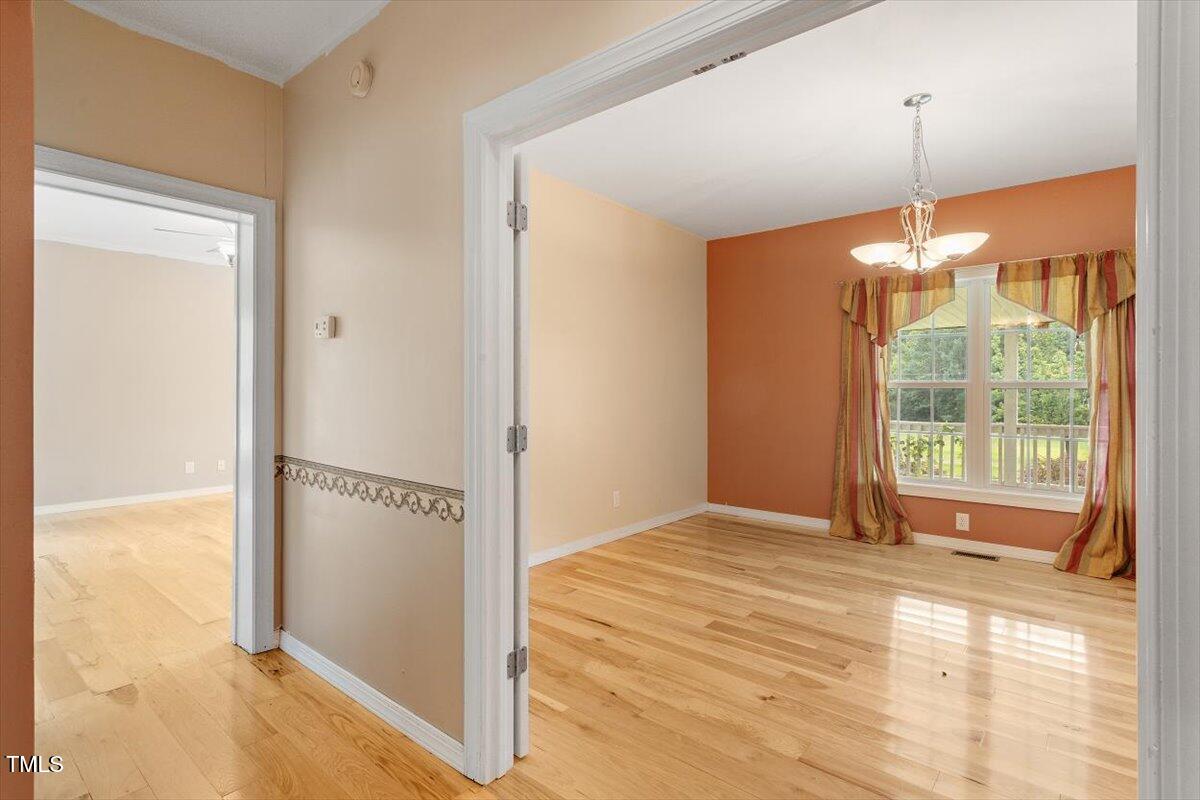 1175 Faulkner Town Road Henderson, NC 27537 - Photo 28 of 48 a view of a room with window walk in closet and kitchen space