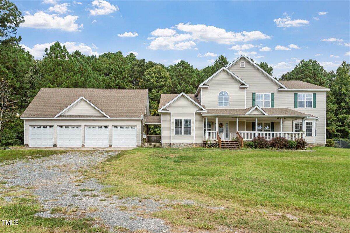 1175 Faulkner Town Road Henderson, NC 27537 - Photo 3 of 48 a view of a house with a big yard and large trees