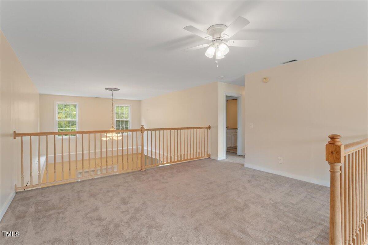 1175 Faulkner Town Road Henderson, NC 27537 - Photo 32 of 48 a view of a livingroom with a ceiling fan and window