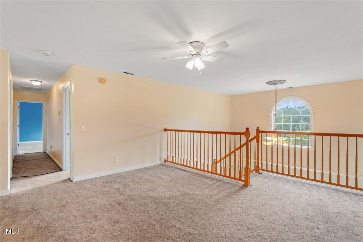 1175 Faulkner Town Road Henderson, NC 27537 - Photo 35 of 48 a view of a livingroom with a ceiling fan and window