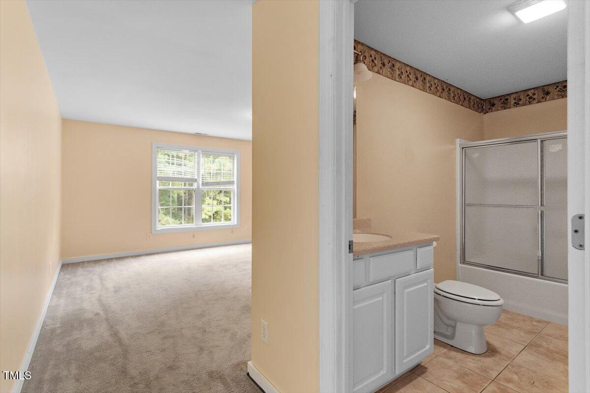 1175 Faulkner Town Road Henderson, NC 27537 - Photo 38 of 48 a bathroom with a toilet sink and a shower