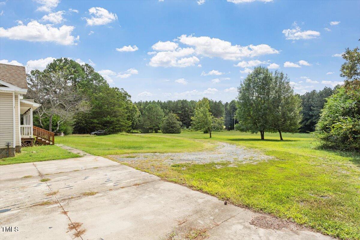 1175 Faulkner Town Road Henderson, NC 27537 - Photo 4 of 48 a view of a playground with basketball court