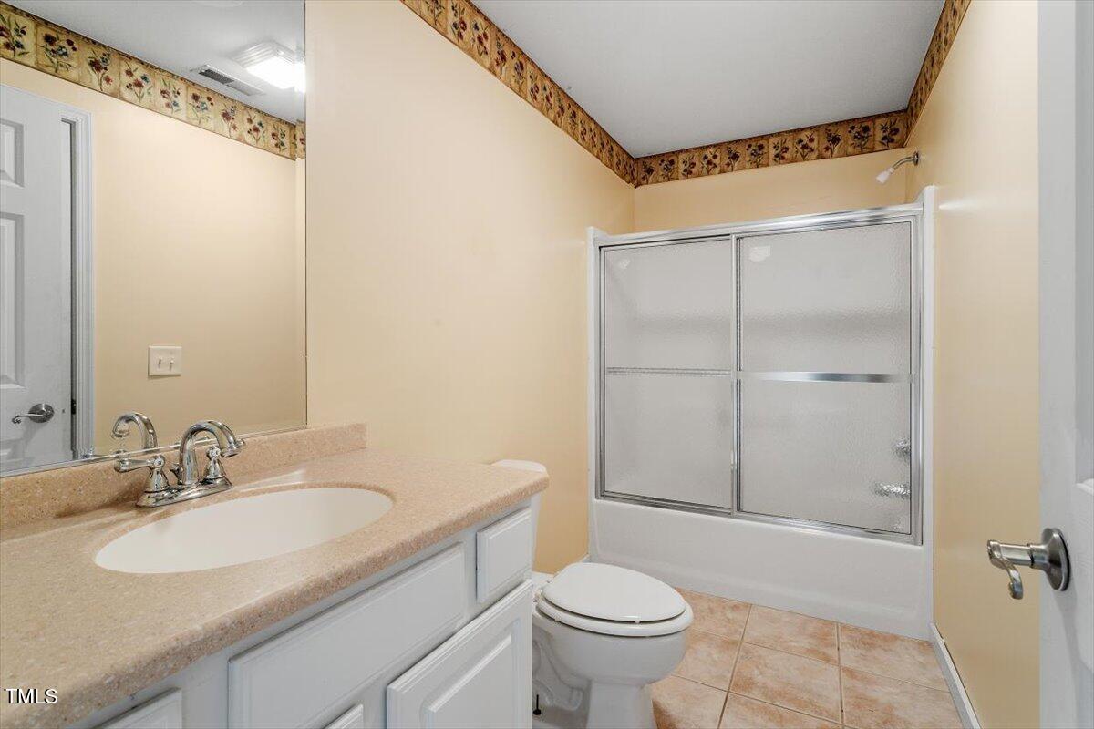 1175 Faulkner Town Road Henderson, NC 27537 - Photo 41 of 48 a bathroom with a granite countertop sink toilet and shower