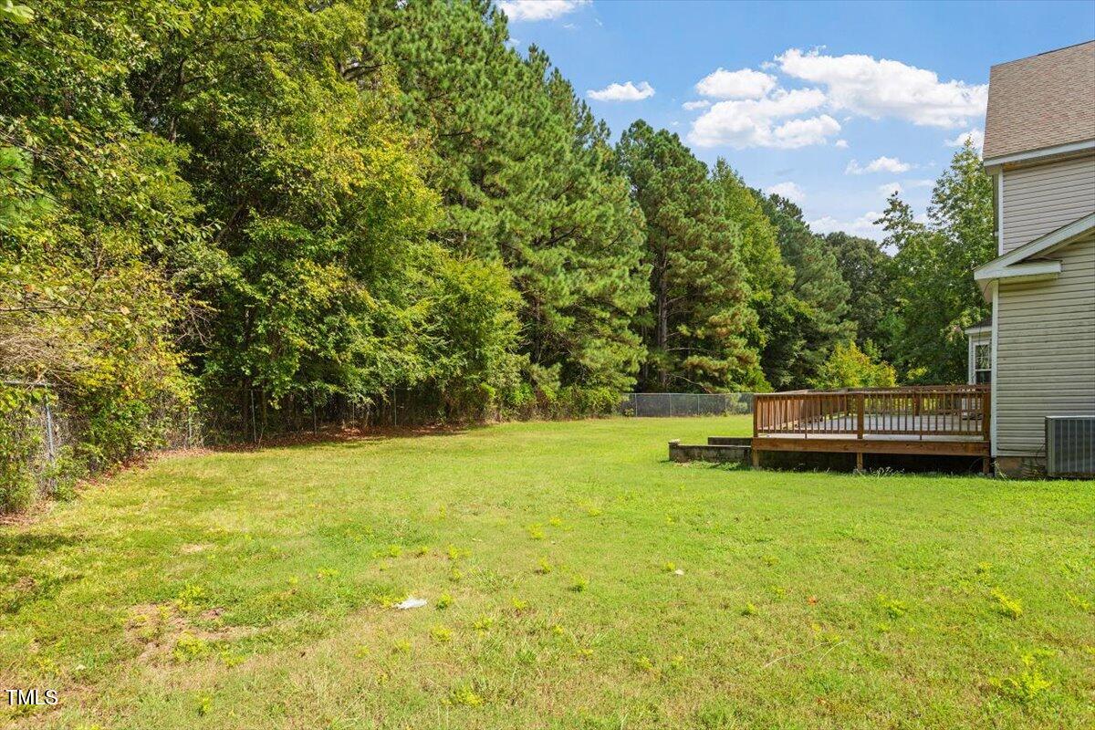 1175 Faulkner Town Road Henderson, NC 27537 - Photo 8 of 48 a backyard of a house with lots of green space
