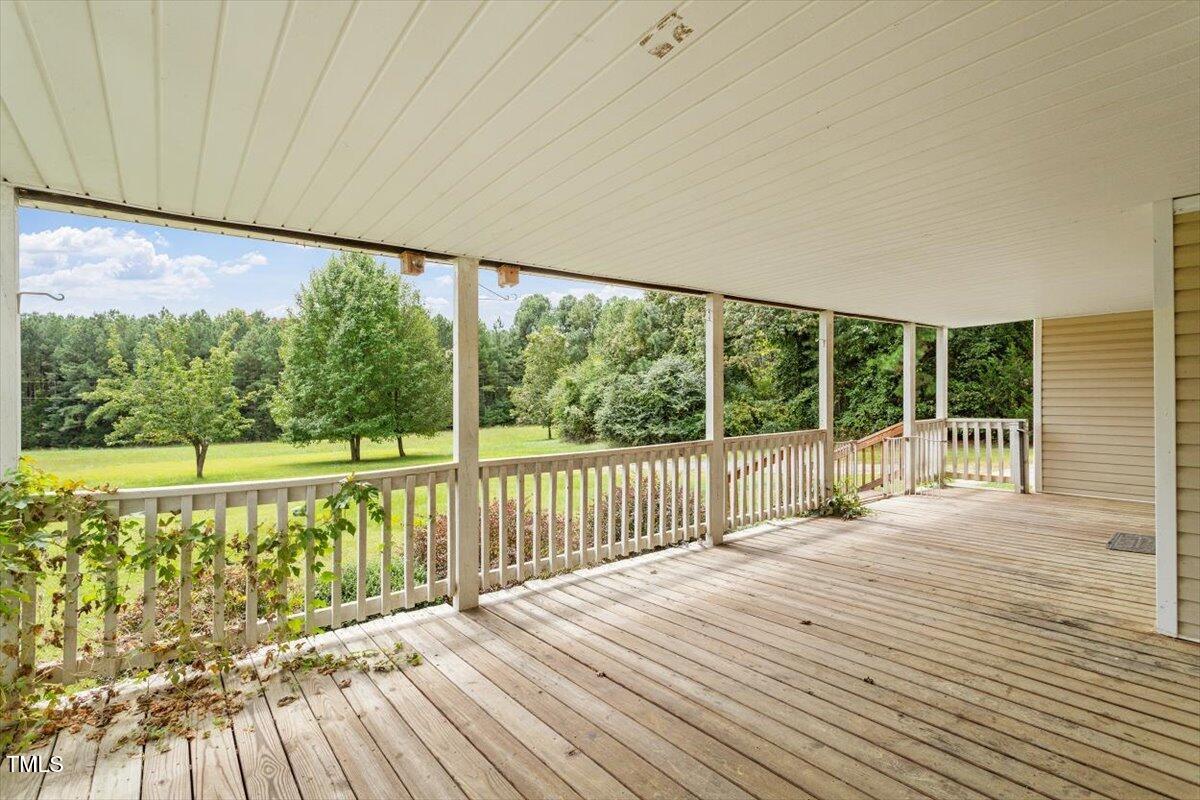 1175 Faulkner Town Road Henderson, NC 27537 - Photo 10 of 48 a view of a room with wooden floor and windows