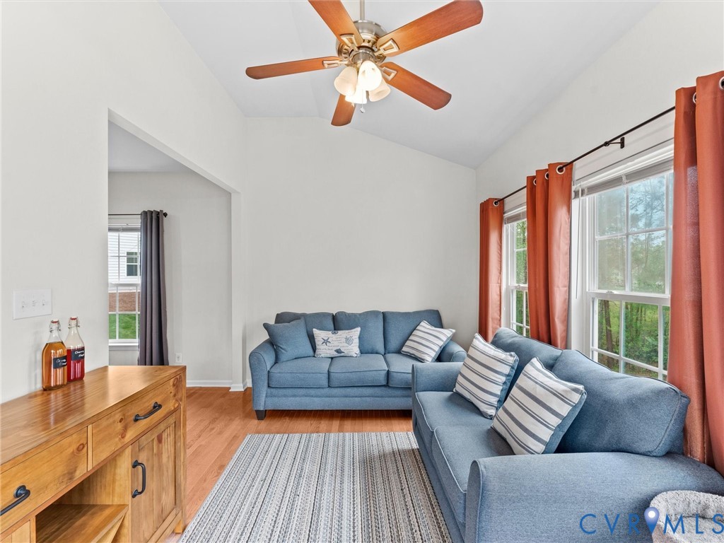 7036 Heartleaf Lane Moseley, VA 23120 - Photo 12 of 28 a living room with furniture and a large window
