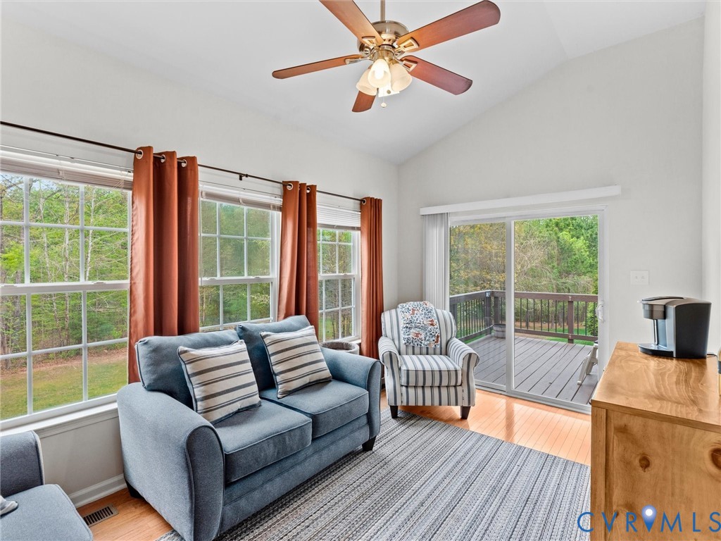 7036 Heartleaf Lane Moseley, VA 23120 - Photo 13 of 28 a living room with furniture and a large window