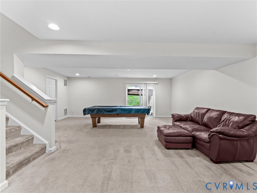 7036 Heartleaf Lane Moseley, VA 23120 - Photo 14 of 28 a living room with furniture and a couch