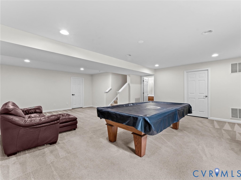 7036 Heartleaf Lane Moseley, VA 23120 - Photo 15 of 28 a living room with furniture pool and a table