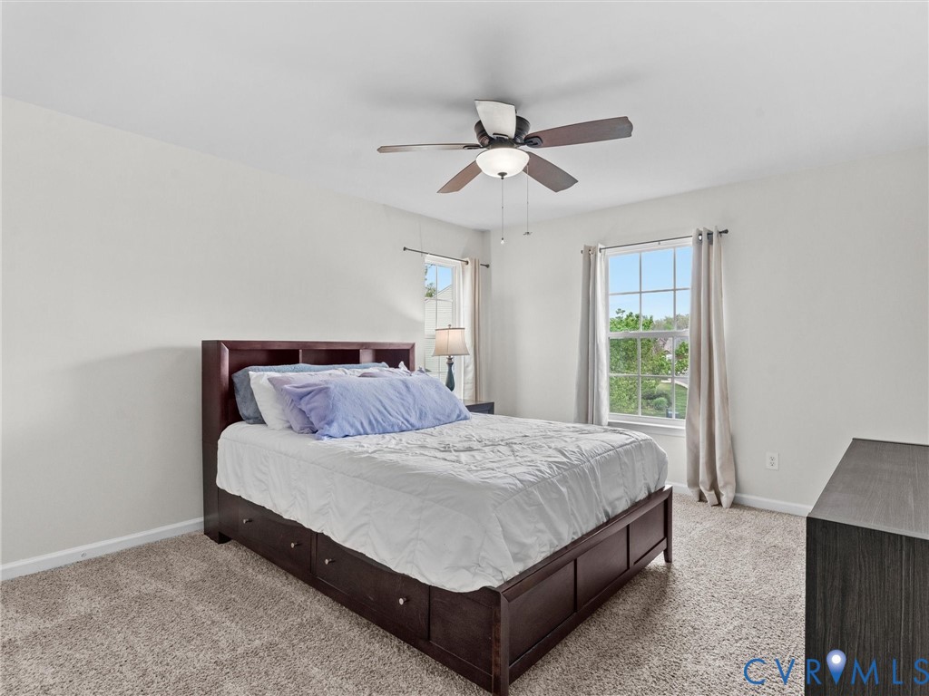 7036 Heartleaf Lane Moseley, VA 23120 - Photo 19 of 28 a bedroom with a bed and window