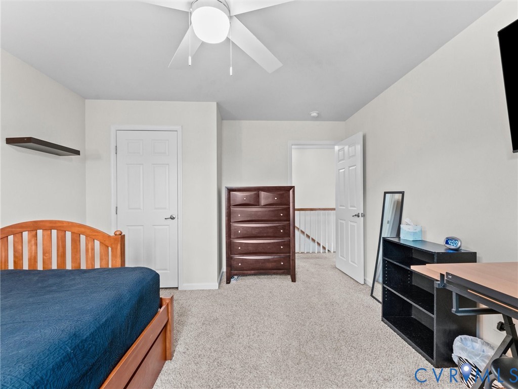 7036 Heartleaf Lane Moseley, VA 23120 - Photo 20 of 28 a bedroom with a bed and furniture