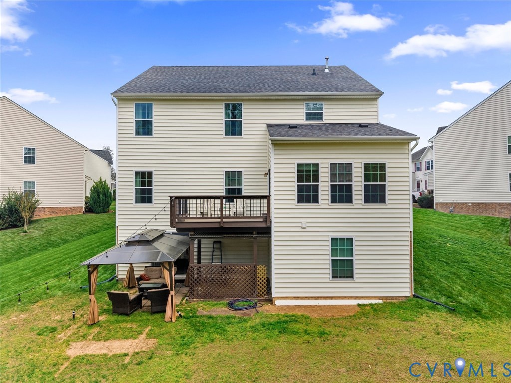 7036 Heartleaf Lane Moseley, VA 23120 - Photo 24 of 28 a view of a house with a yard and sitting area