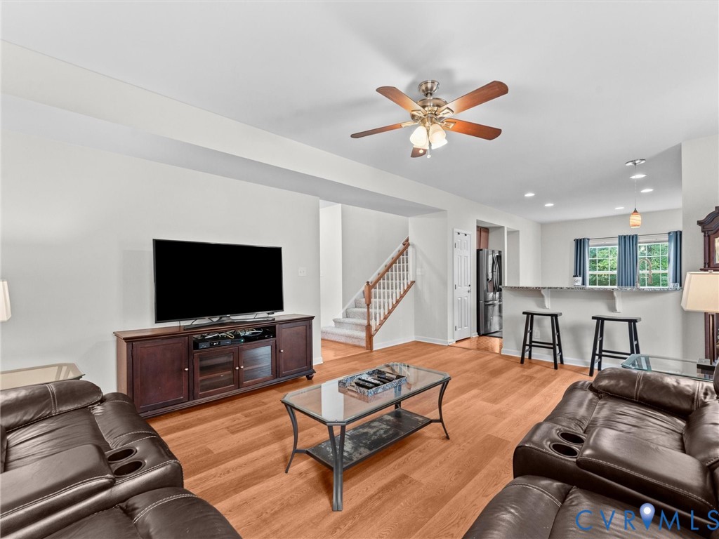 7036 Heartleaf Lane Moseley, VA 23120 - Photo 3 of 28 a living room with furniture and a flat screen tv