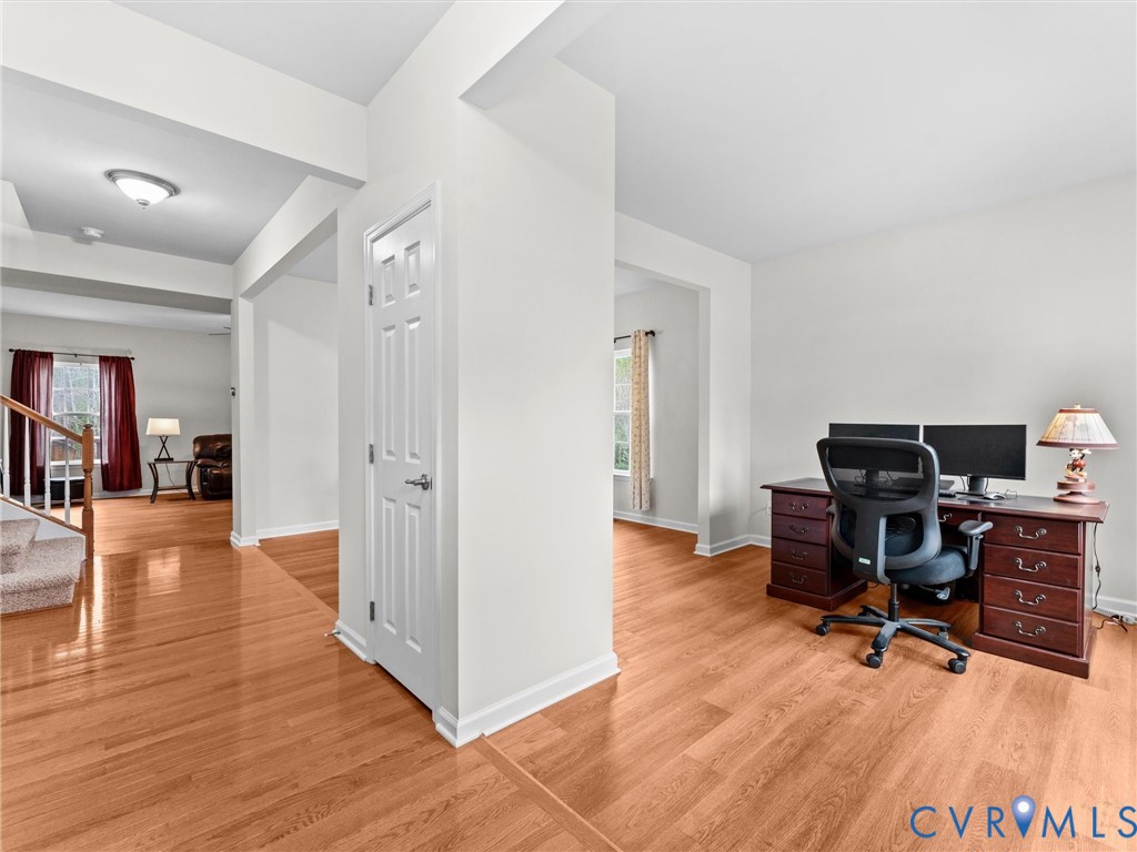 7036 Heartleaf Lane Moseley, VA 23120 - Photo 4 of 28 a view of a workspace with wooden floor and furniture