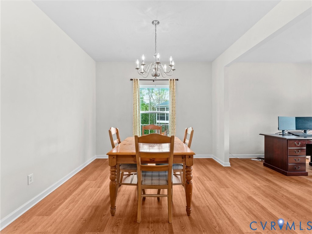 7036 Heartleaf Lane Moseley, VA 23120 - Photo 6 of 28 a dining room with furniture and wooden floor