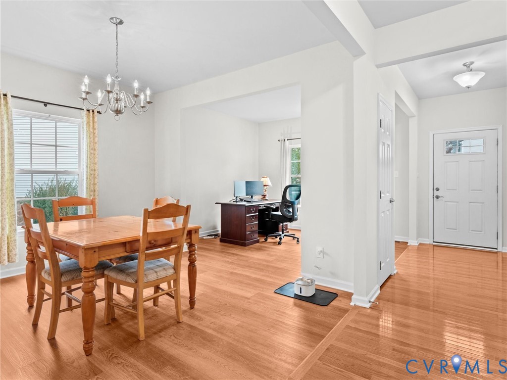 7036 Heartleaf Lane Moseley, VA 23120 - Photo 7 of 28 a view of a livingroom with furniture and wooden floor