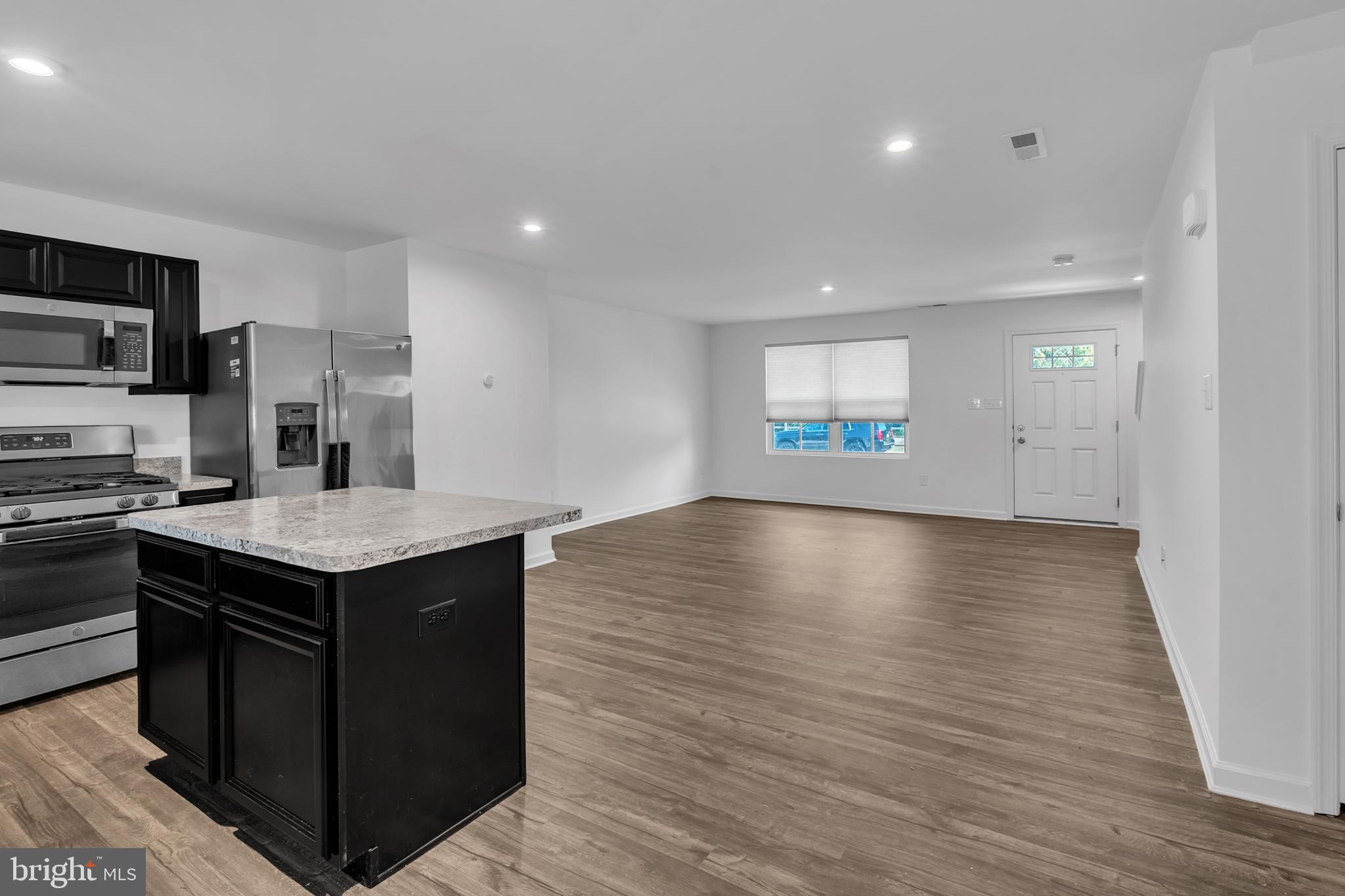144 Ciseley Drive Sicklerville, NJ 08081 - Photo 21 of 48 a kitchen with a stove and a wooden floor