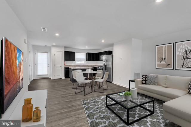 144 Ciseley Drive Sicklerville, NJ 08081 - Photo 23 of 48 a living room with furniture and a flat screen tv