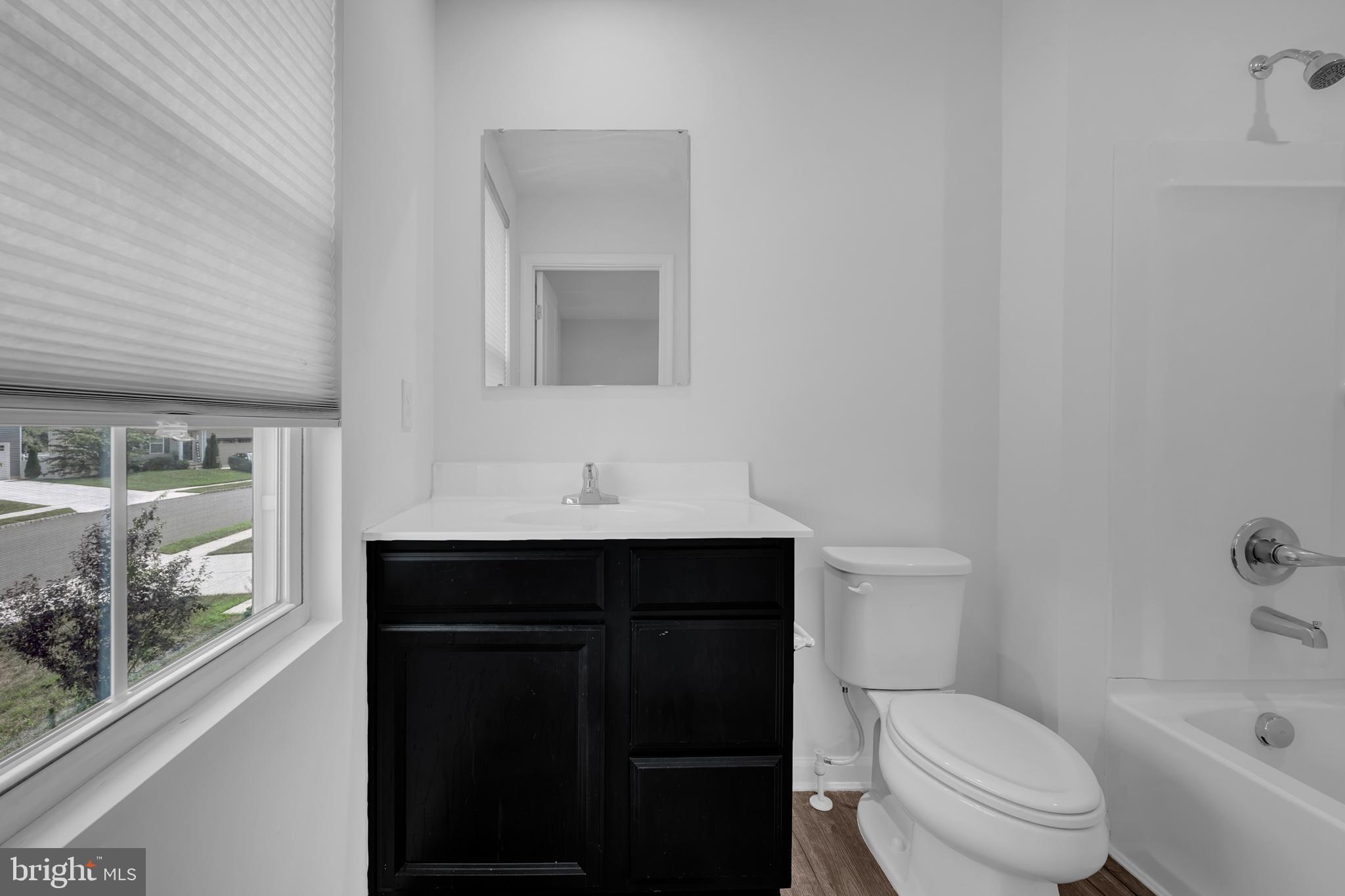 144 Ciseley Drive Sicklerville, NJ 08081 - Photo 26 of 48 a bathroom with a sink toilet vanity and tub