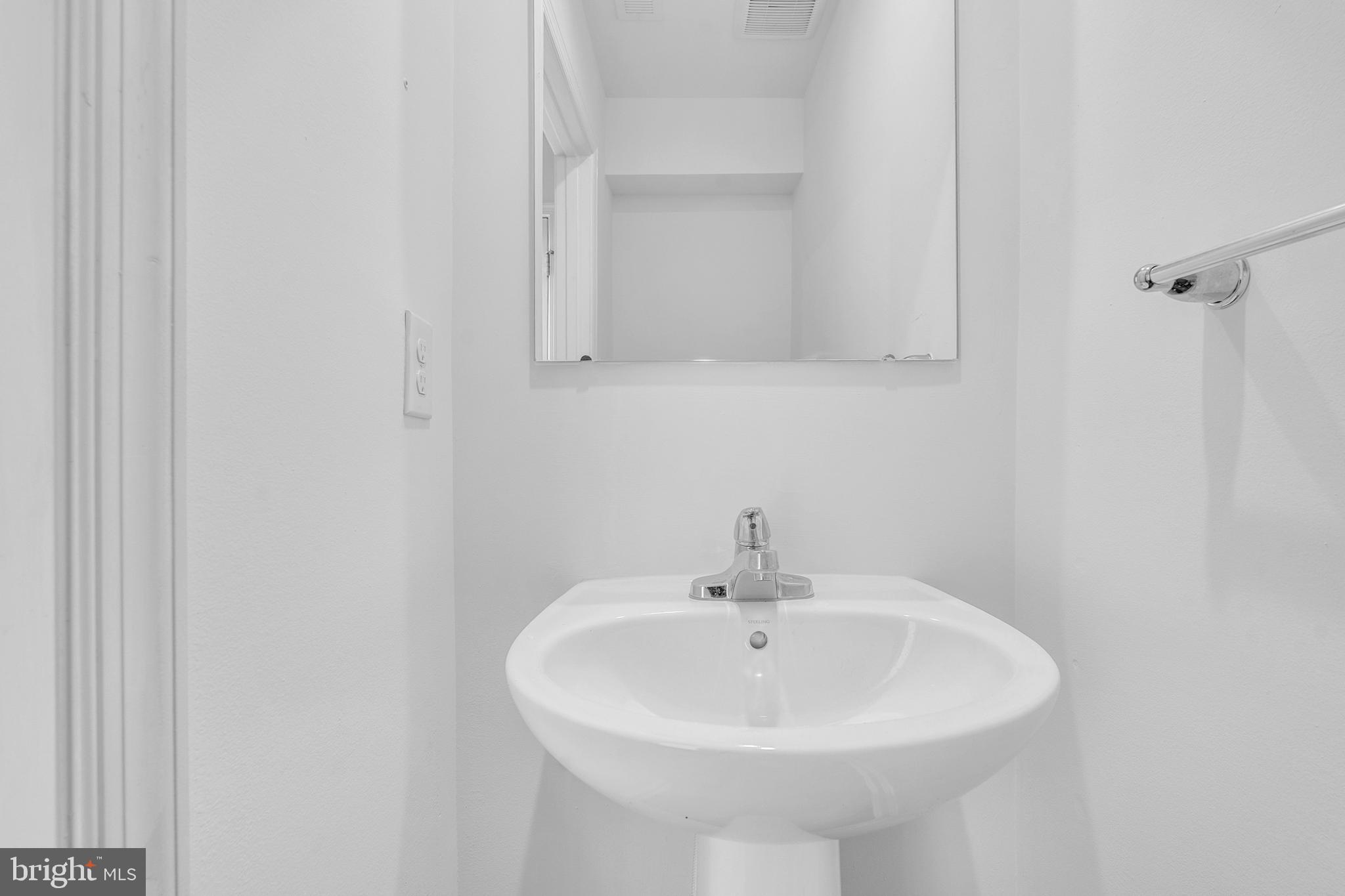 144 Ciseley Drive Sicklerville, NJ 08081 - Photo 27 of 48 a bathroom with a sink and a mirror