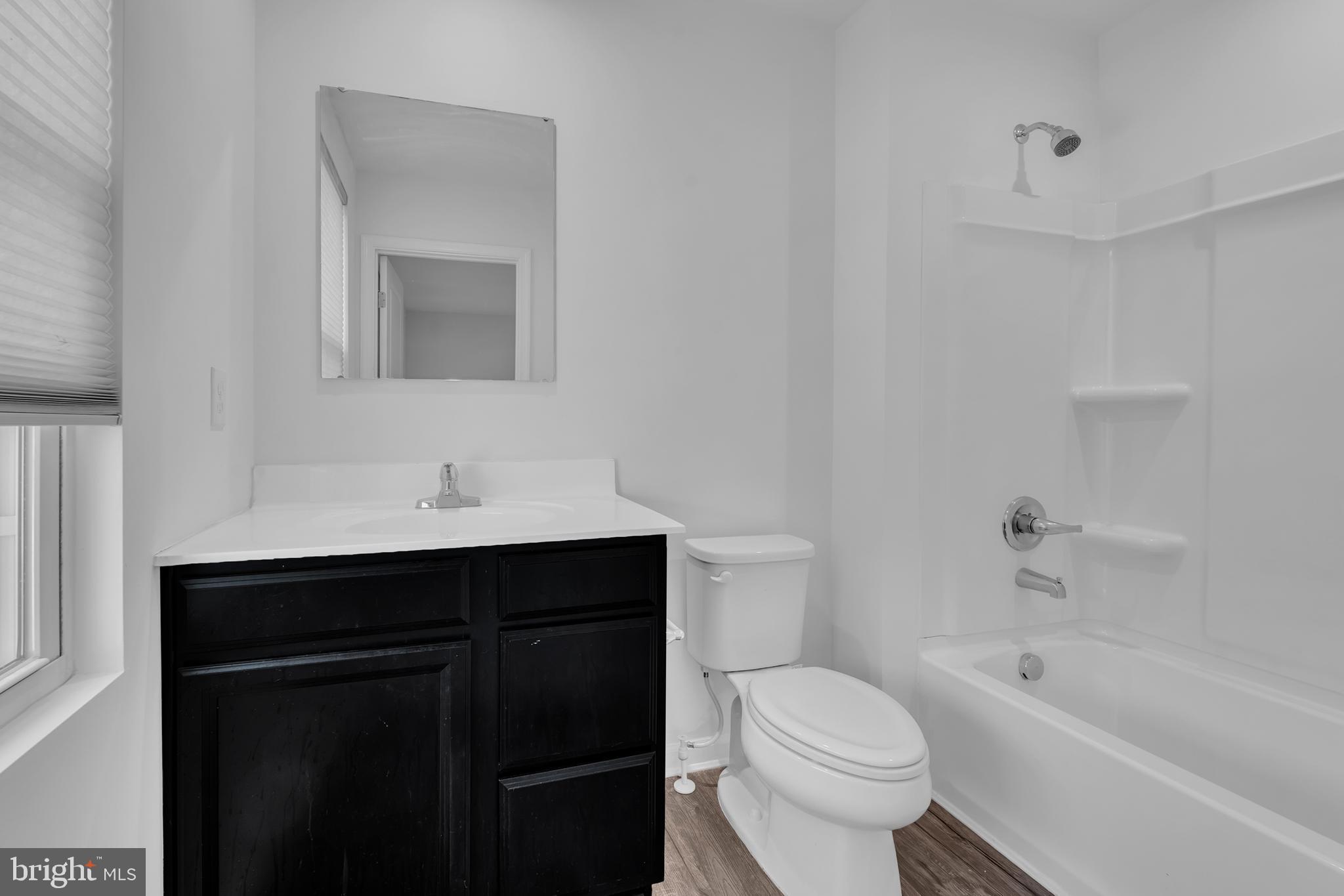 144 Ciseley Drive Sicklerville, NJ 08081 - Photo 28 of 48 a bathroom with a sink toilet vanity and bathtub